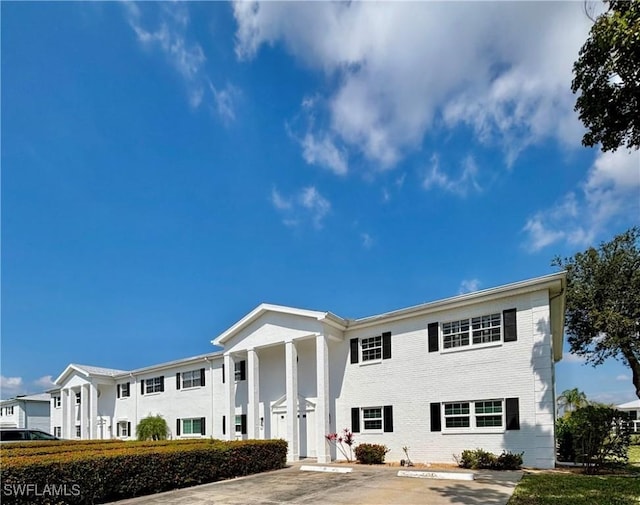 1465 Saddle Woode Dr Unit 6G, Fort Myers, FL 33919 - view of front of home with uncovered parking and brick siding