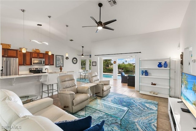 living room with light tile patterned floors, high vaulted ceiling, visible vents, and a ceiling fan