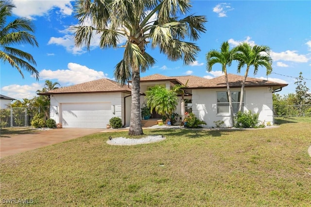 view of front facade with stucco siding, concrete driveway, fence, a garage, and a front lawn