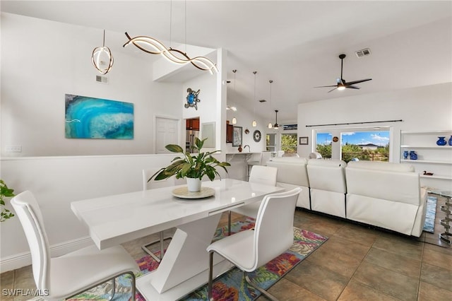 tiled dining space with ceiling fan, high vaulted ceiling, and visible vents