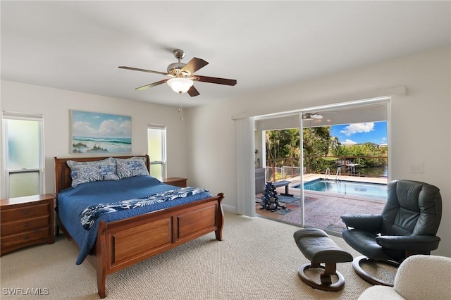 bedroom with access to outside, multiple windows, a ceiling fan, and light colored carpet