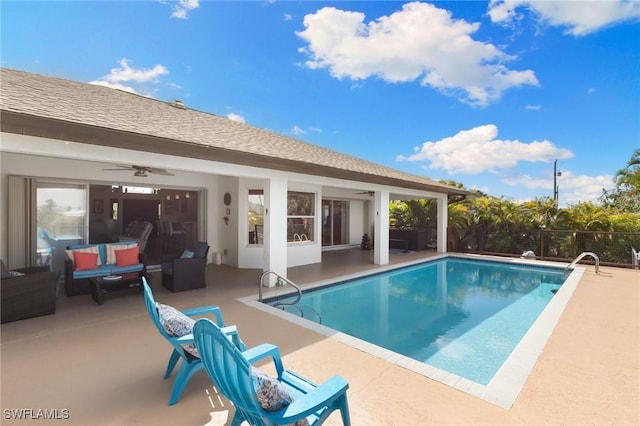 view of pool featuring a fenced in pool, a patio, and an outdoor living space