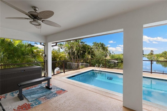 view of swimming pool with ceiling fan and a fenced in pool