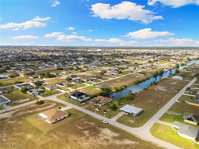 bird's eye view with a residential view and a water view