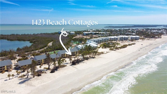 bird's eye view featuring a view of the beach and a water view