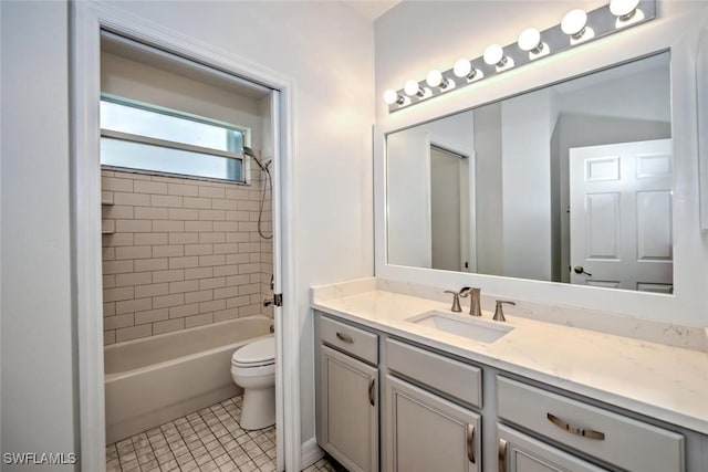 bathroom featuring bathtub / shower combination, vanity, toilet, and tile patterned floors