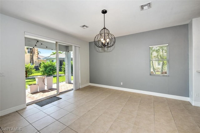 unfurnished room with visible vents, a notable chandelier, baseboards, and light tile patterned floors