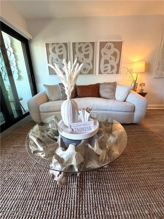 living room with wood finished floors and baseboards