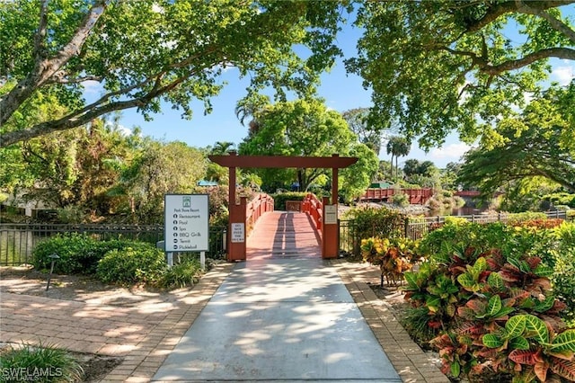 view of community featuring fence