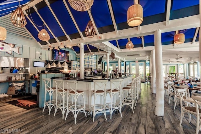 bar featuring a dry bar and wood finished floors