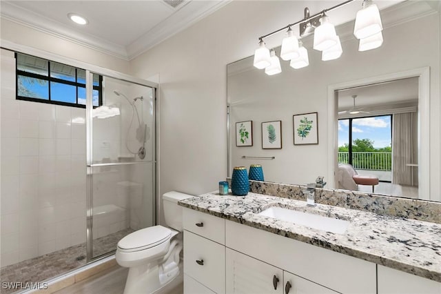 bathroom featuring a wealth of natural light, toilet, a stall shower, and ornamental molding