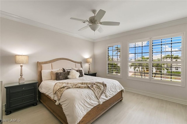 bedroom with light wood-style flooring, baseboards, ceiling fan, and crown molding