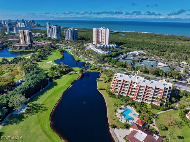 drone / aerial view featuring a view of city and a water view