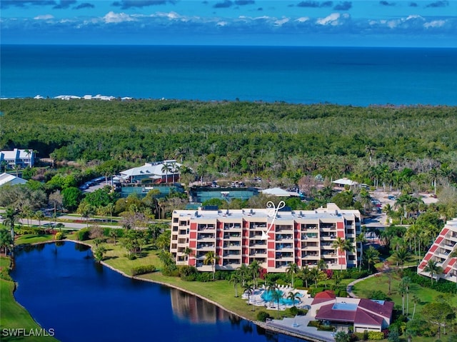 aerial view featuring a water view and a forest view