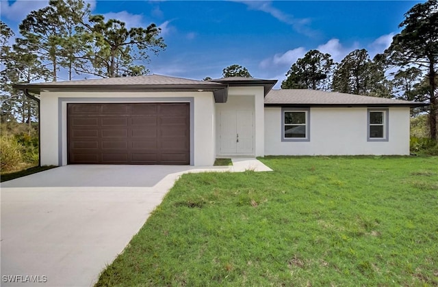 view of front of home featuring a garage, concrete driveway, a front lawn, and stucco siding