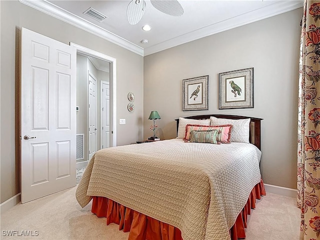 bedroom featuring crown molding, baseboards, visible vents, and light colored carpet