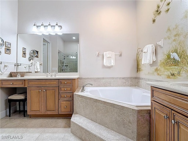 bathroom featuring a garden tub, a shower stall, tile patterned flooring, and two vanities