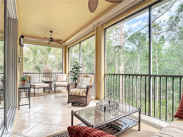 sunroom / solarium with a ceiling fan