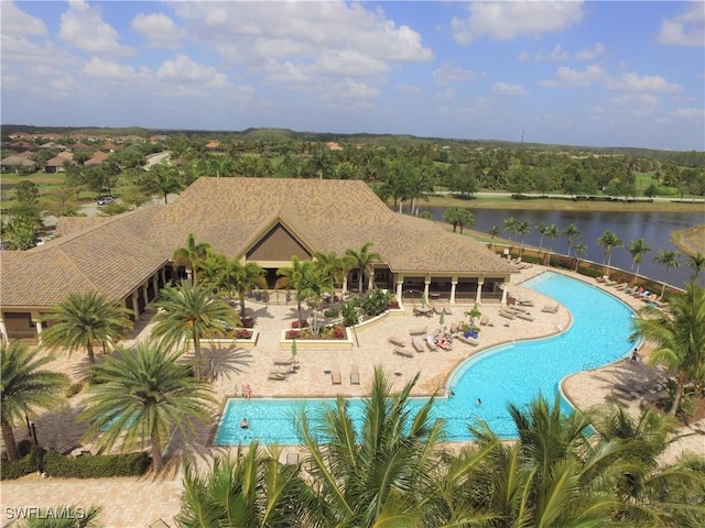 pool with a water view and a patio