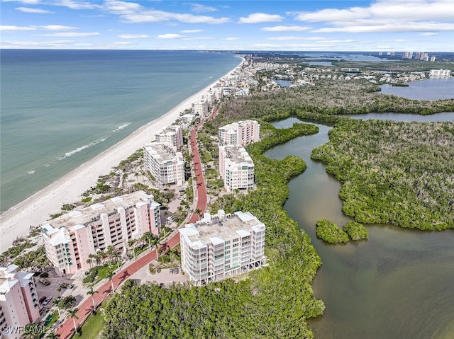 birds eye view of property with a view of city, a beach view, and a water view