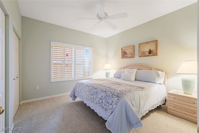 bedroom featuring carpet floors, a ceiling fan, and baseboards