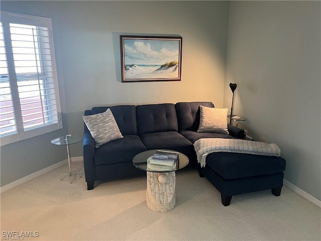 living area with carpet flooring and baseboards