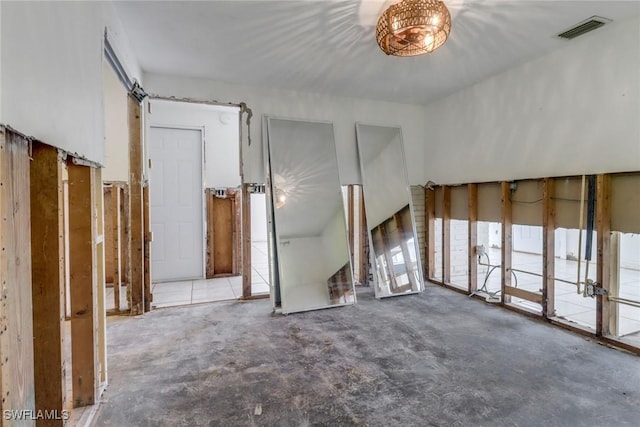 unfurnished room with visible vents and concrete floors