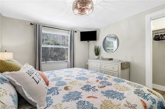 bedroom featuring baseboards