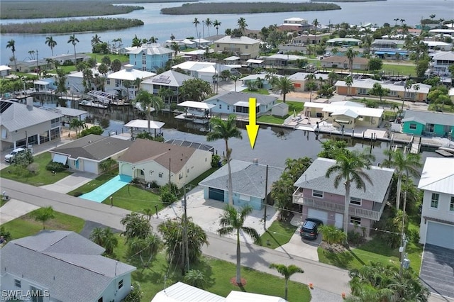 aerial view with a water view and a residential view