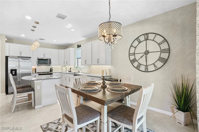 dining space featuring visible vents, a notable chandelier, recessed lighting, light tile patterned floors, and baseboards