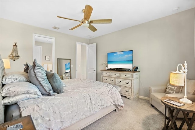 bedroom with visible vents, light colored carpet, baseboards, and a ceiling fan