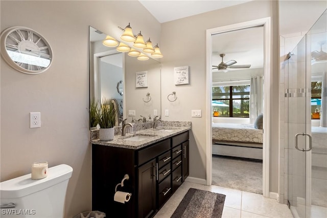 full bath with double vanity, a stall shower, ensuite bathroom, and a sink