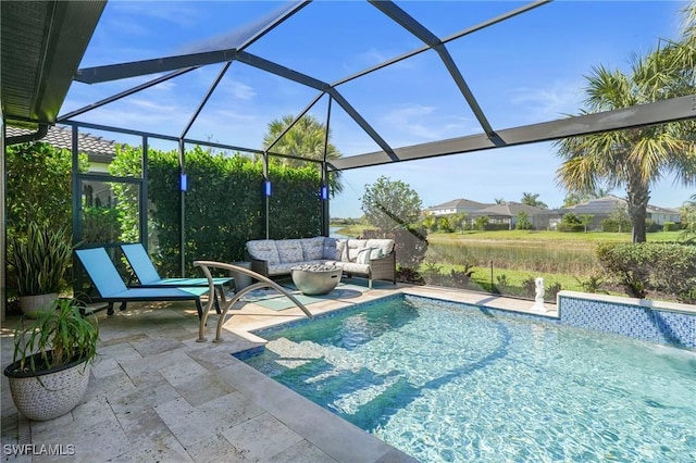 outdoor pool featuring outdoor lounge area, a patio, and a lanai