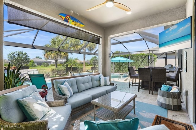 exterior space featuring outdoor dining space, glass enclosure, an outdoor hangout area, and ceiling fan