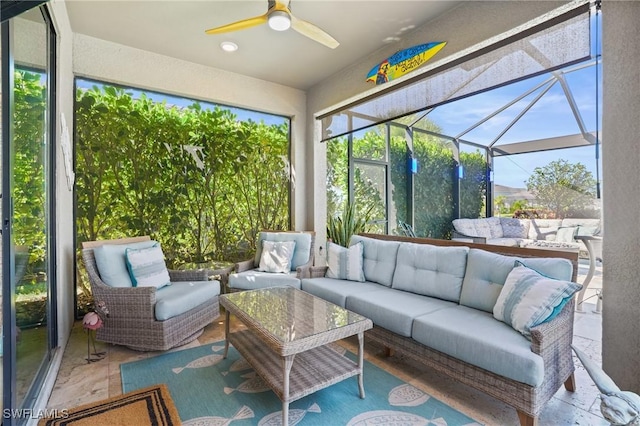 sunroom with ceiling fan