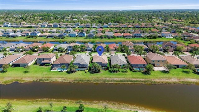 bird's eye view with a residential view and a water view