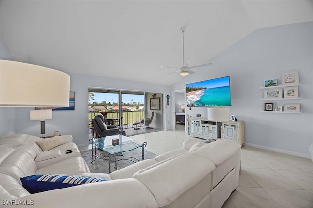 living area featuring light tile patterned floors, ceiling fan, baseboards, and vaulted ceiling