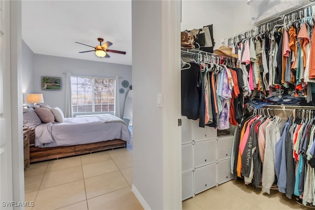 interior space featuring a ceiling fan and tile patterned floors