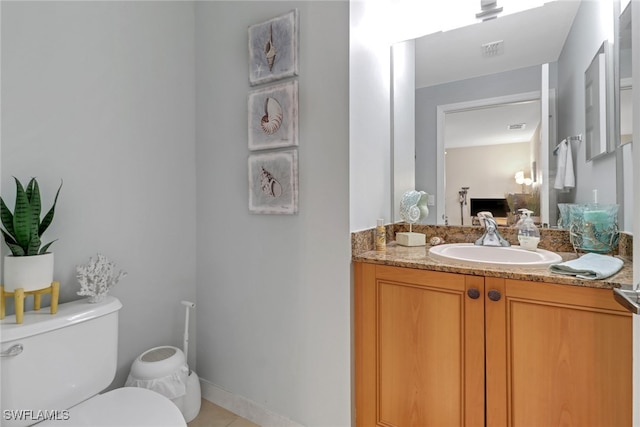 half bath with toilet, visible vents, and vanity