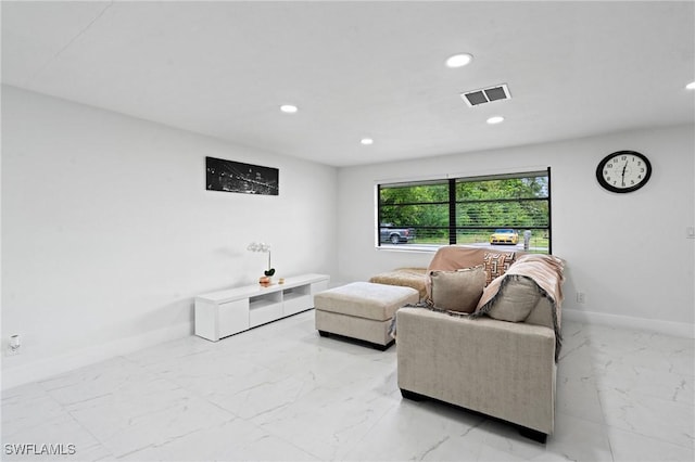 living room featuring marble finish floor, baseboards, visible vents, and recessed lighting