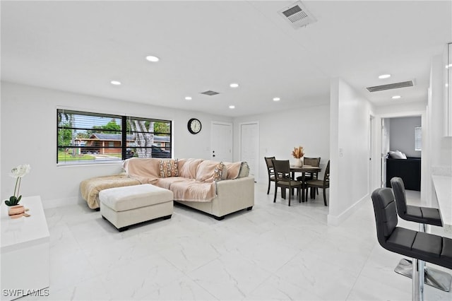 living area featuring marble finish floor, visible vents, and recessed lighting