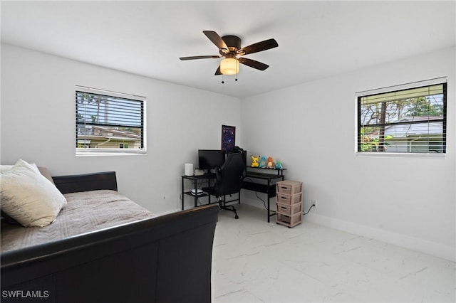 bedroom with marble finish floor, multiple windows, baseboards, and a ceiling fan