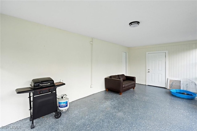 living area featuring speckled floor