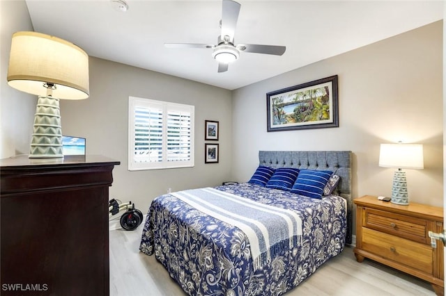 bedroom with ceiling fan and wood finished floors