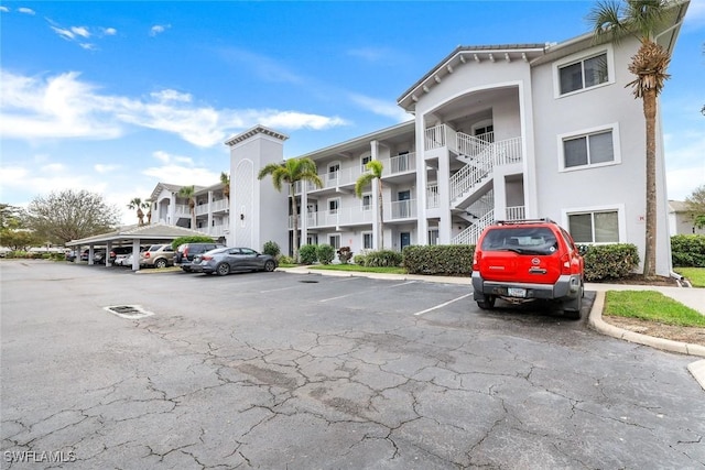 view of property with uncovered parking