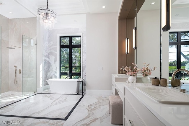 bathroom featuring baseboards, marble finish floor, vanity, a freestanding tub, and a shower stall