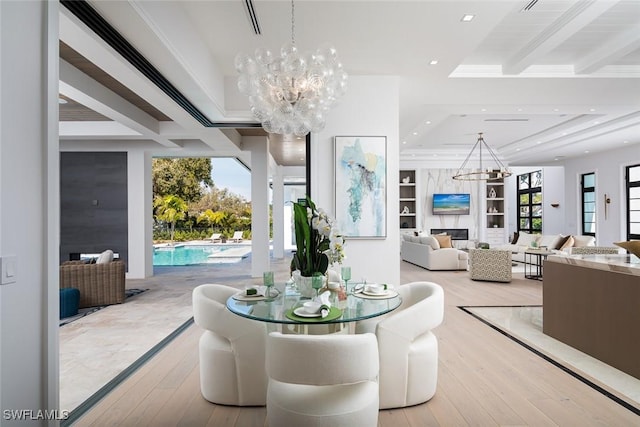 dining area with recessed lighting, a notable chandelier, a premium fireplace, hardwood / wood-style floors, and beamed ceiling