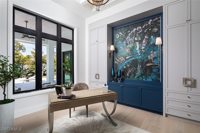 foyer featuring baseboards and light wood-style floors