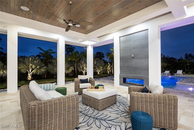 view of patio / terrace with a ceiling fan, outdoor lounge area, and an outdoor pool