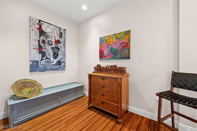 interior space with recessed lighting, wood finished floors, and baseboards